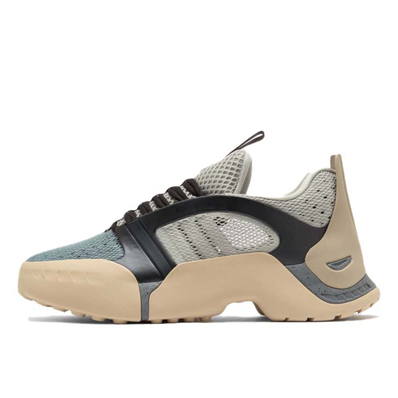 ADIDAS Kouza DYZ sneaker with a futuristic silhouette and sculpted sole in a bold streetwear style.