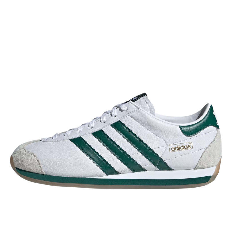 Adidas Gazelle sneakers in suede with three-layered design, serrated 3-Stripes, and metallic-gold "Gazelle" emblem.