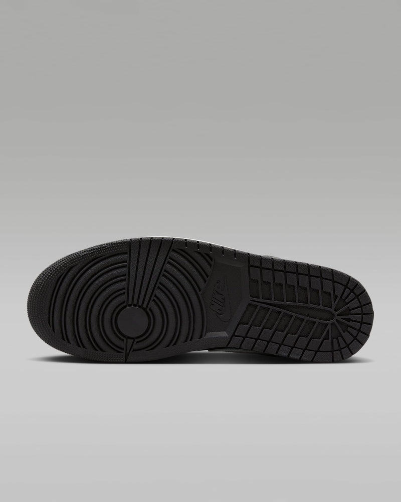 Air Jordan 1 Low sneakers in classic colorway, side profile view.