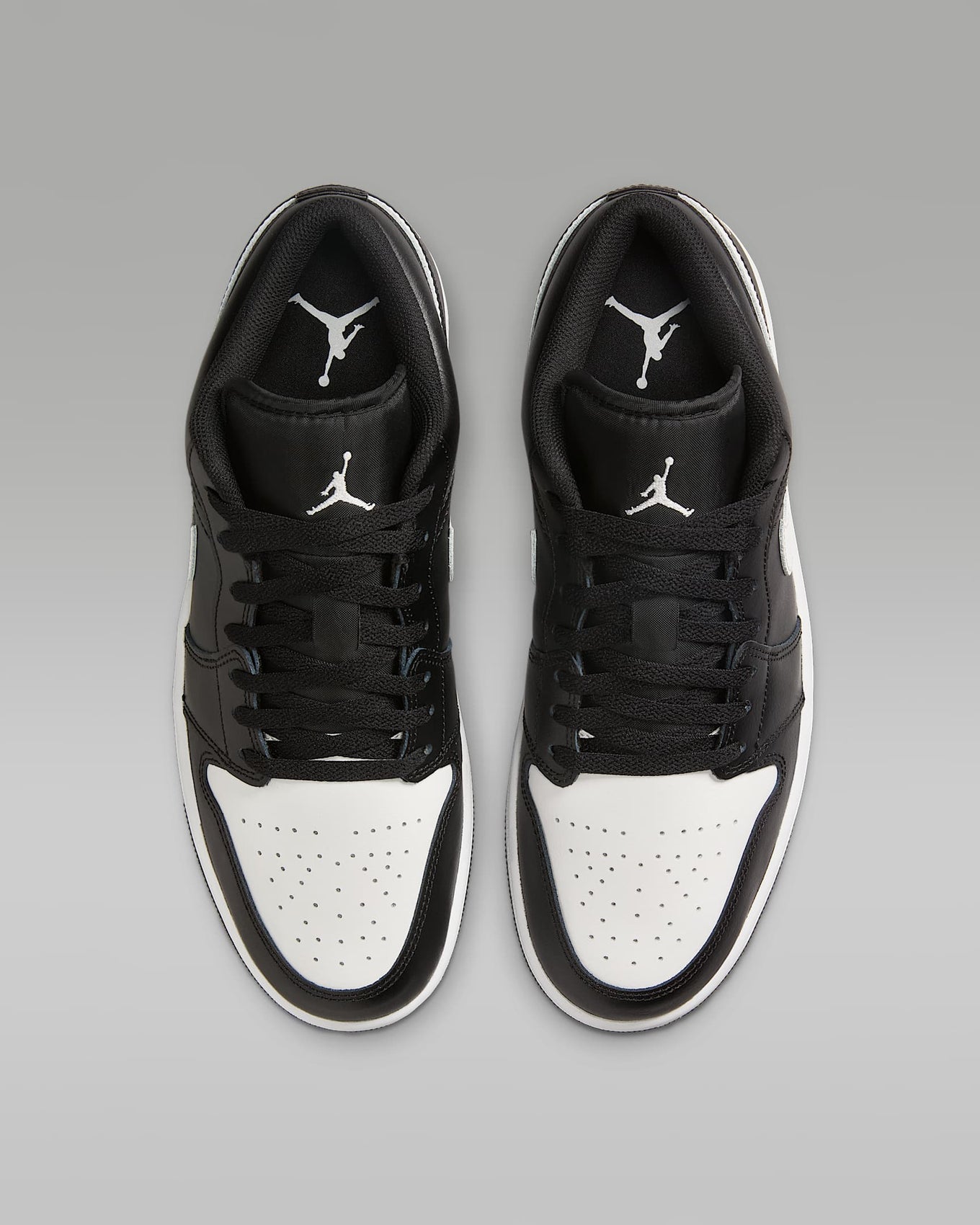 Air Jordan 1 Low sneakers in classic colorway, side profile view.