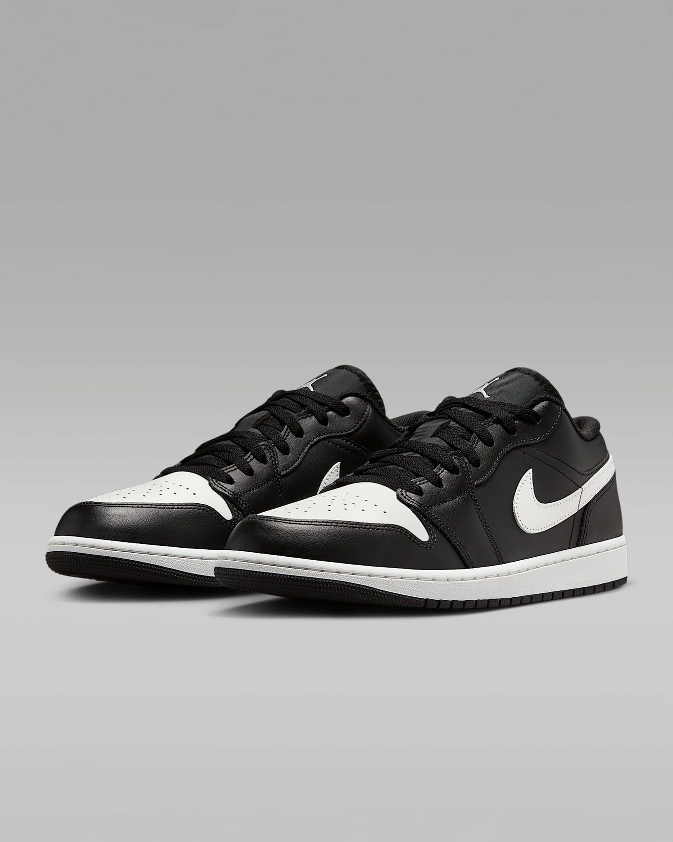 Air Jordan 1 Low sneakers in classic colorway, side profile view.