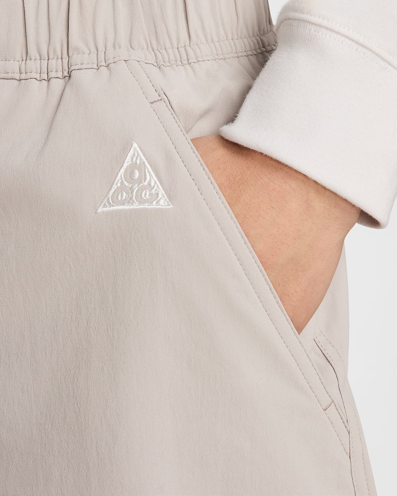 Nike ACG hiking shorts with a sweat-wicking, water-repellent design, roomy fit, and mobility gusset for comfort on and off the trail.