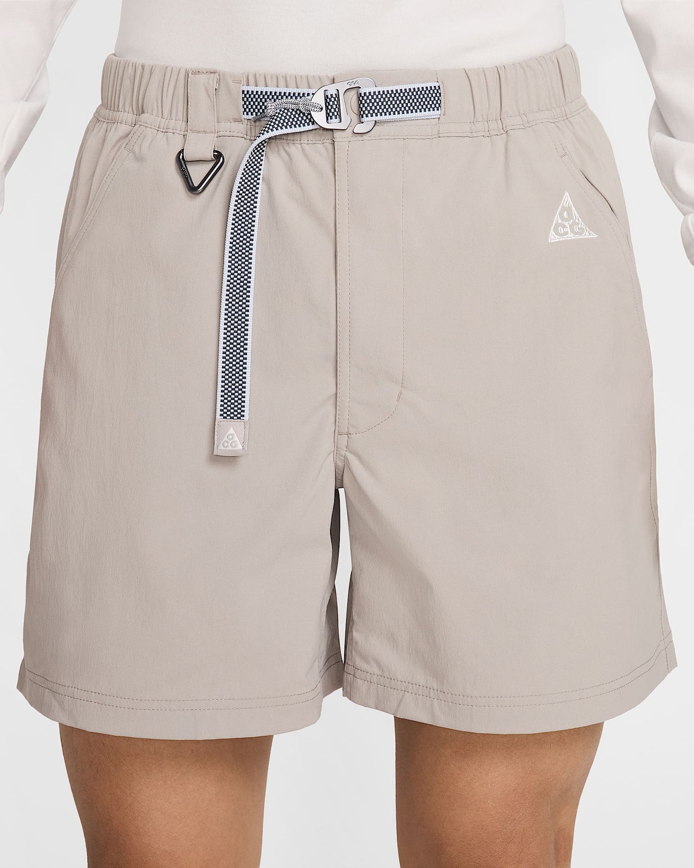Nike ACG hiking shorts with a sweat-wicking, water-repellent design, roomy fit, and mobility gusset for comfort on and off the trail.