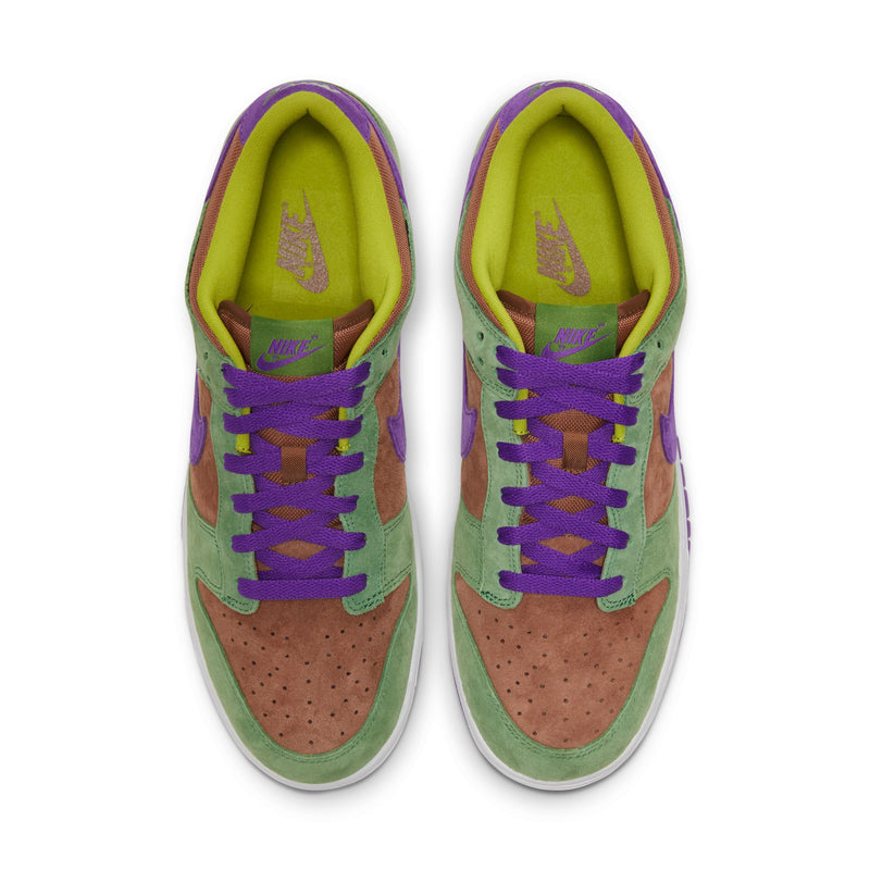 Close-up of the Dunk Low 'Veneer' sneaker featuring a suede upper in green, purple, and brown hues. 