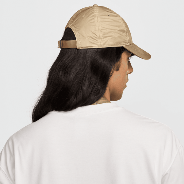 Nike AeroBill Cap with lightweight flexible bill, unstructured 6-panel design, and adjustable strap and buckle