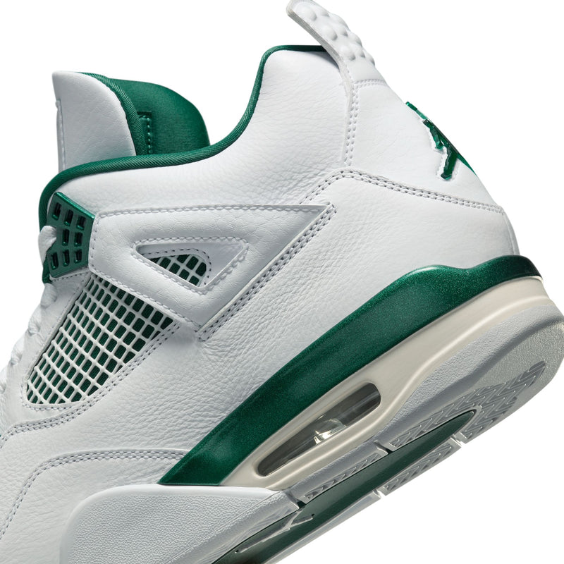 The Air Jordan 4 sneakers in white leather with Oxidised Green accents, featuring metallic lustre on the eyelets, midsole, and branding.