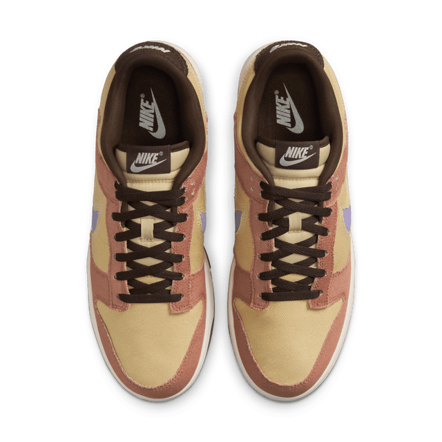 Dunk Low sneaker with iconic color blocking, corduroy layers, and plush padding for comfort and style.