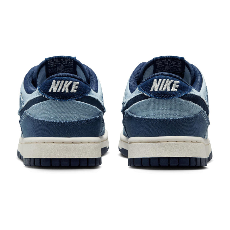 Denim-inspired Dunk Low with tonal blocking, soft upper, foam midsole, and durable rubber outsole.