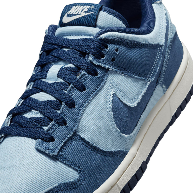 Denim-inspired Dunk Low with tonal blocking, soft upper, foam midsole, and durable rubber outsole.