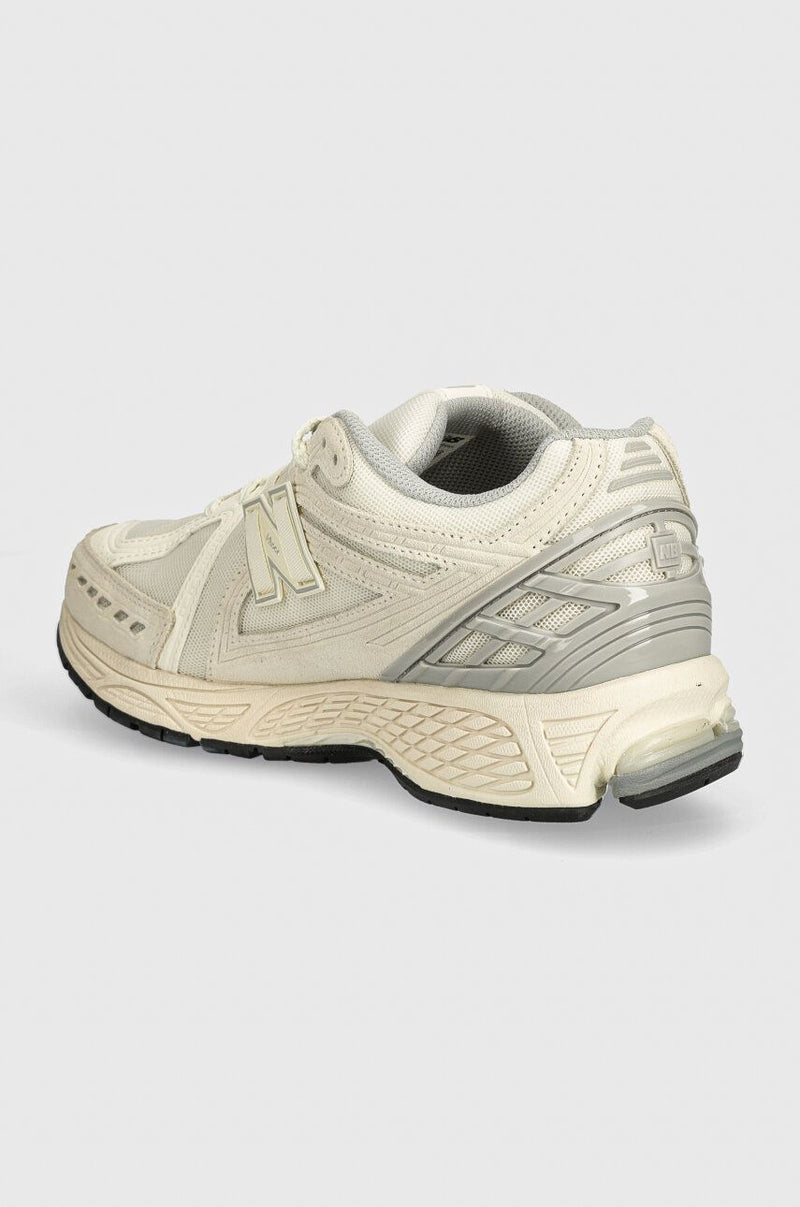 New Balance M1906U shoes with mesh and leather upper, featuring N-Durance rubber sole, N-Ergy cushioning, and Stability Web support.


