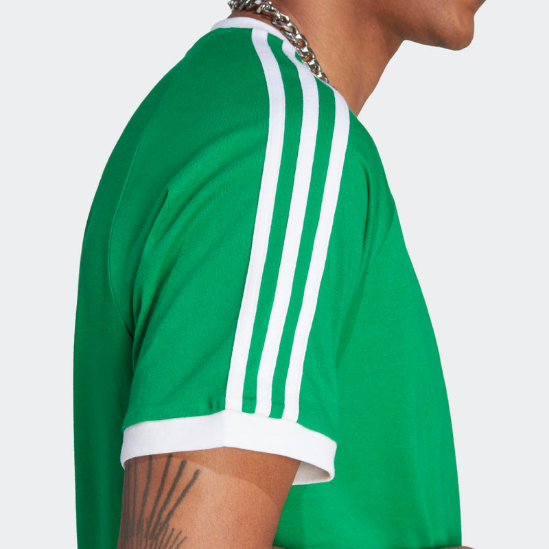 Adidas classic t-shirt with a slim fit and contrast hem, made from ultra-soft cotton, showcasing a refined vintage style.


