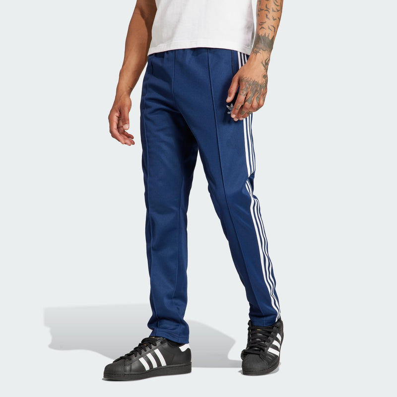 adidas Adicolor Beckenbauer Track Pants with embroidered Trefoil and 3-Stripes detailing, crafted from soft cotton blend, emphasizing comfort and sustainability.