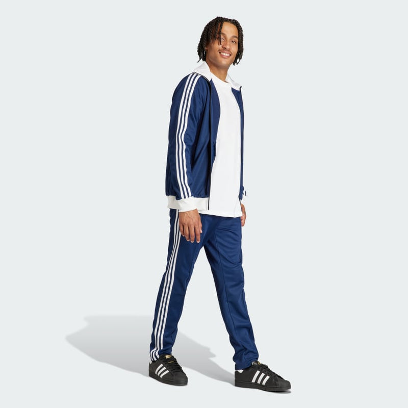 adidas Adicolor Beckenbauer Track Pants with embroidered Trefoil and 3-Stripes detailing, crafted from soft cotton blend, emphasizing comfort and sustainability.