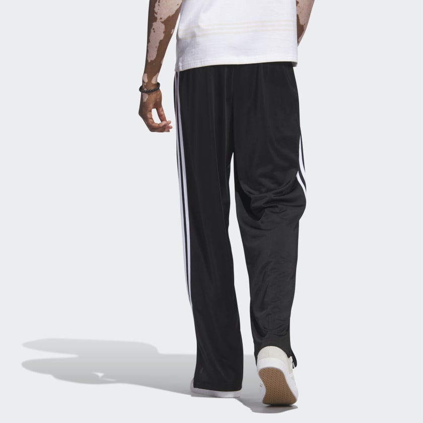 Adicolor Firebird pants showcasing a classic design with a modern cut, featuring an embroidered Trefoil logo, 3-Stripes along the legs, and zip pockets for secure storage.



