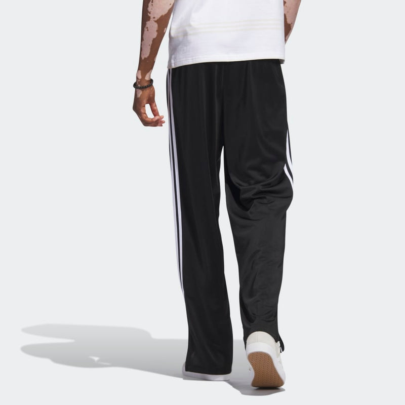 Adicolor Firebird pants showcasing a classic design with a modern cut, featuring an embroidered Trefoil logo, 3-Stripes along the legs, and zip pockets for secure storage.



