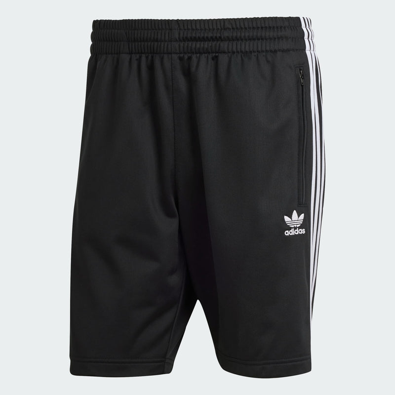 adidas Heritage Shorts made from lightweight tricot fabric, featuring side pockets and an elastic waist with drawcord for a customized fit.