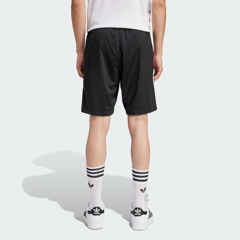adidas Heritage Shorts made from lightweight tricot fabric, featuring side pockets and an elastic waist with drawcord for a customized fit.