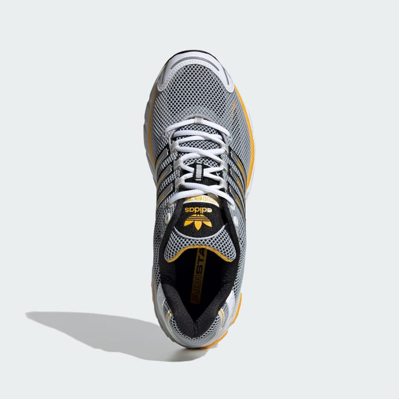 Adidas Adistar Cushion Shoes with breathable mesh upper, Adiprene cushioning, and metallic reflective details, combining retro style with modern comfort.