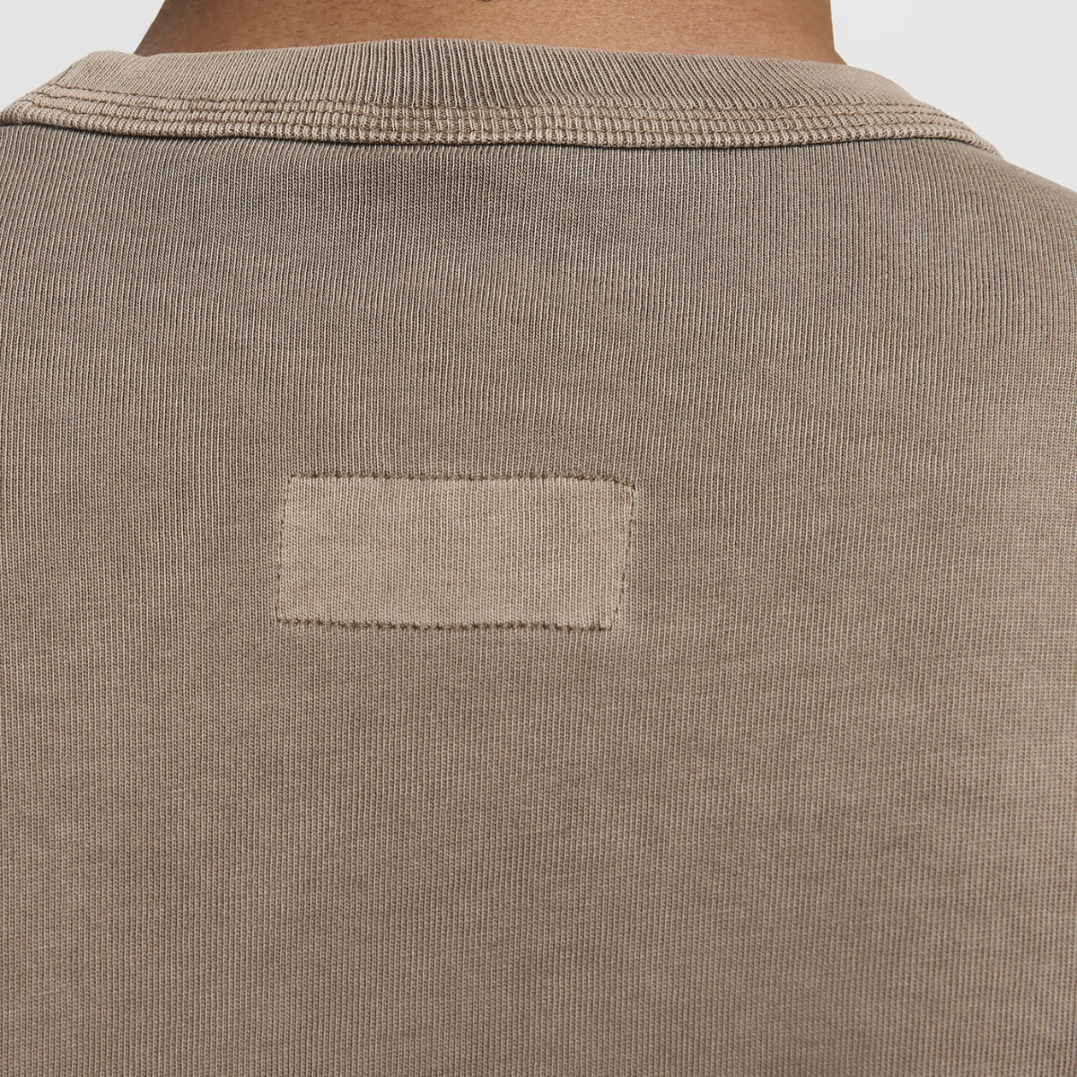 Heavyweight T-shirt with a triple-stitched collar, showcasing unique garment dyeing with natural highlights and lowlights for a distinctive look.



