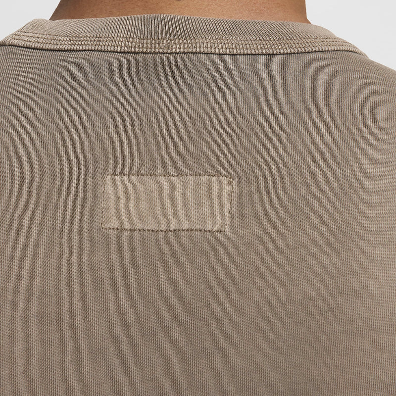 Heavyweight T-shirt with a triple-stitched collar, showcasing unique garment dyeing with natural highlights and lowlights for a distinctive look.



