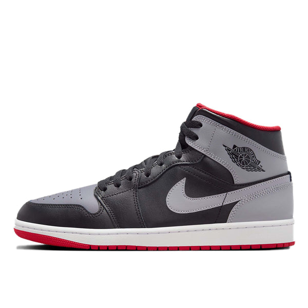 Mid-top sneaker inspired by the original Air Jordan 1, featuring iconic design elements, unique color choices, and crisp leather for a distinct and stylish identity.