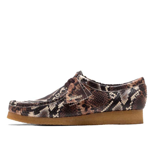 Clarks Wallabee shoe in bold brown snake print with round toe and crepe sole