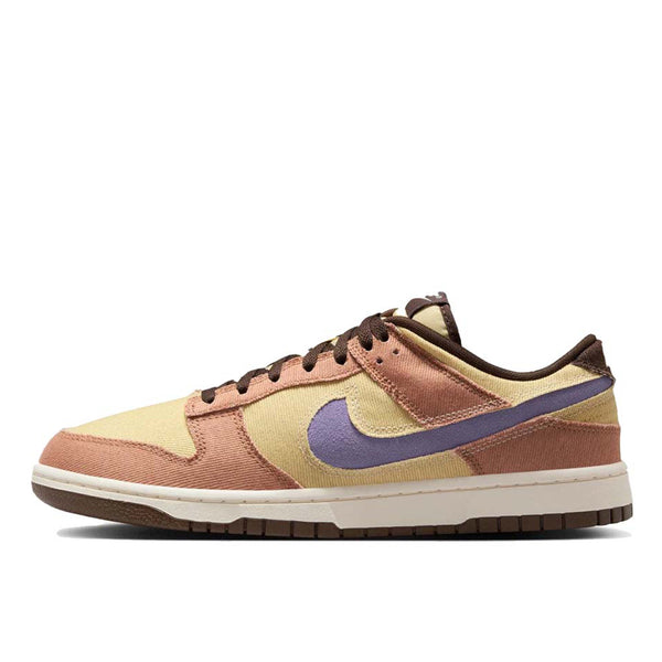 Dunk Low sneaker with iconic color blocking, corduroy layers, and plush padding for comfort and style.