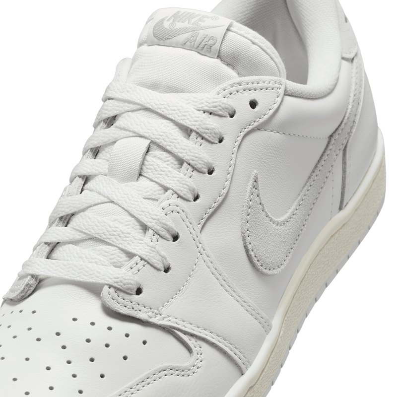 Classic AJ1 '85 Low sneaker crafted from premium leather, featuring Summit White, Light Smoke Grey, and Neutral Grey accents.