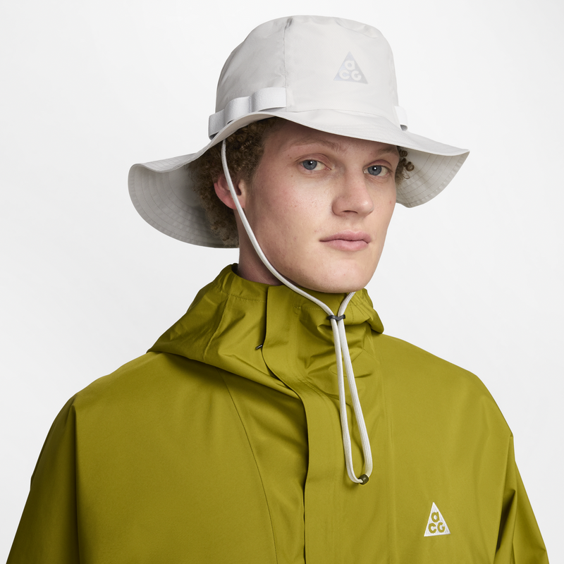 Nike ACG Apex Storm-FIT ADV bucket hat with weather protection technology, lightweight design, durable nylon construction, mesh lining for comfort, and stylish ACG accents.