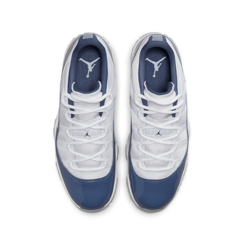 AJ11 sneakers featuring premium leather and lightweight textiles in white, Diffused Blue, and Midnight Navy.