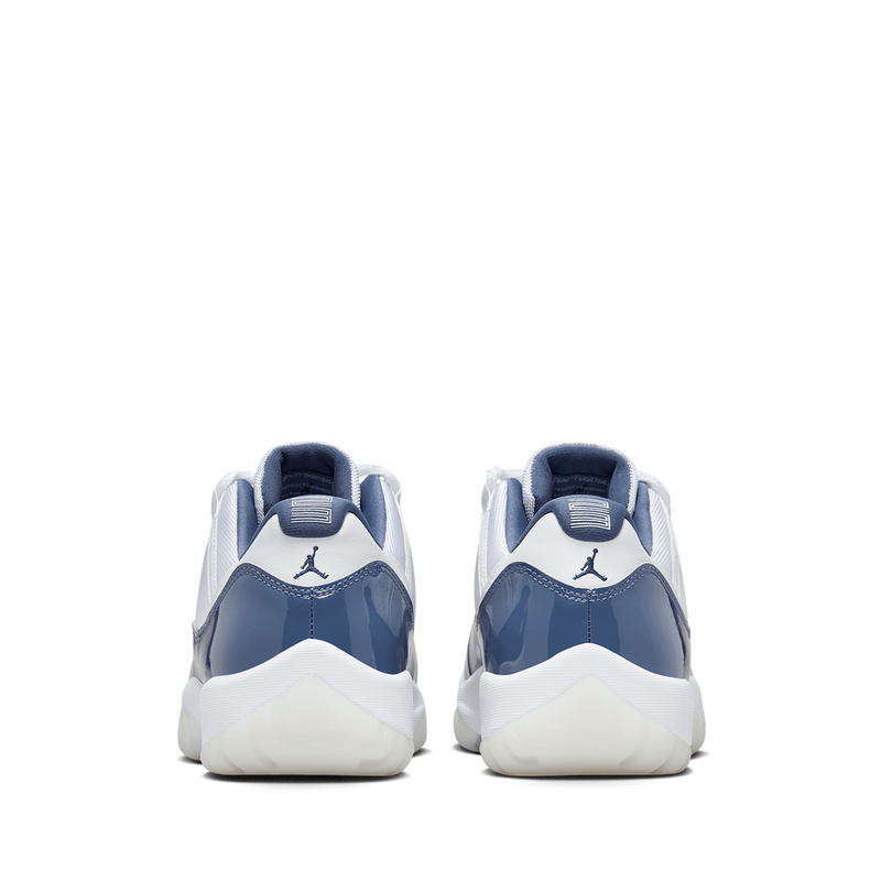 AJ11 sneakers featuring premium leather and lightweight textiles in white, Diffused Blue, and Midnight Navy.