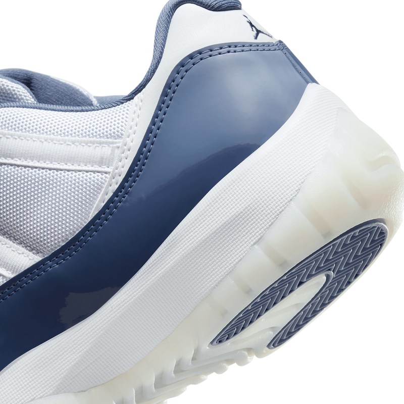 AJ11 sneakers featuring premium leather and lightweight textiles in white, Diffused Blue, and Midnight Navy.