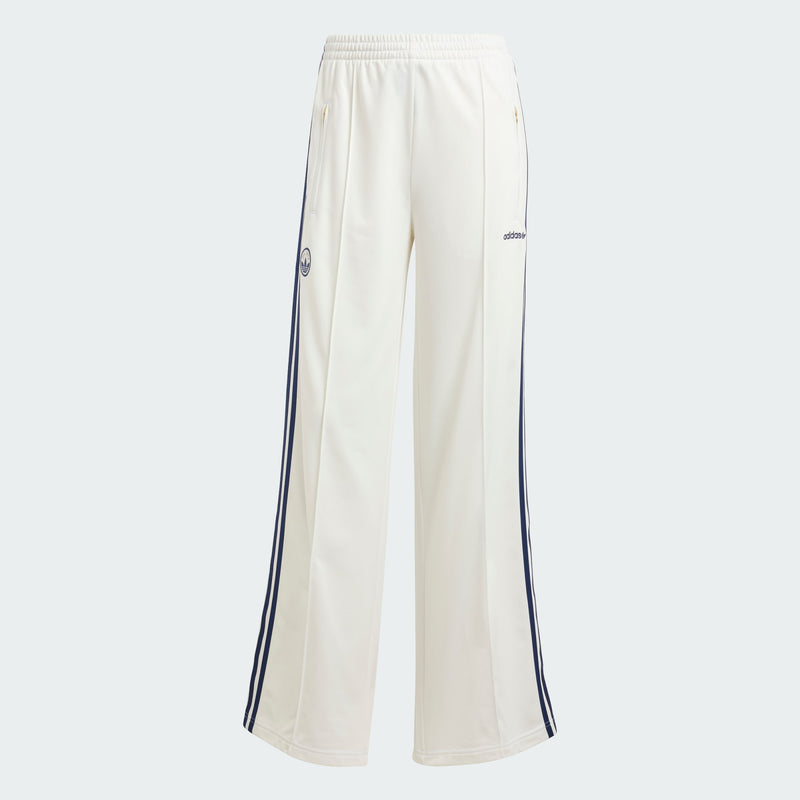 Adidas Firebird track pants featuring classic 3-Stripes, signature tricot sheen, and colors inspired by international competition, embodying a timeless sports style.



