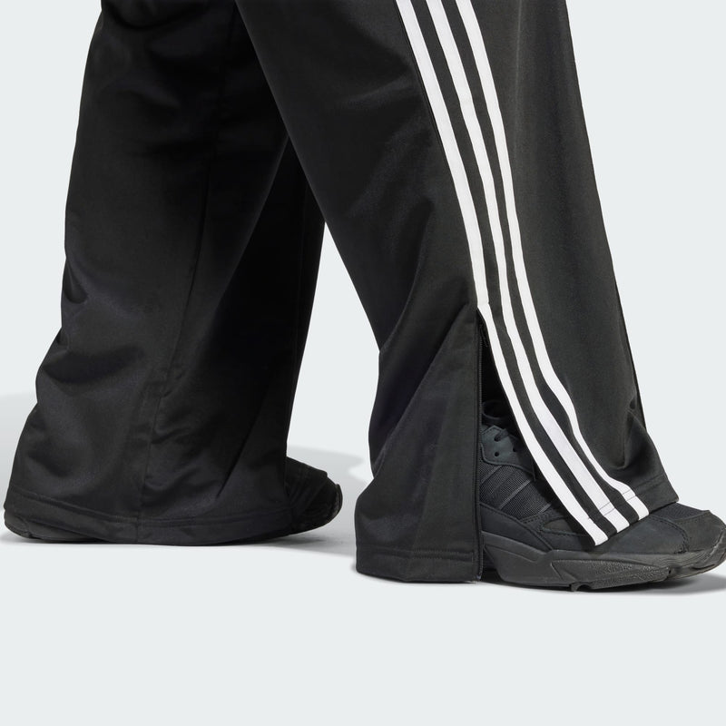 Adidas Originals Firebird track pants with 3-Stripes and Trefoil logo, made from 100% recycled materials.


