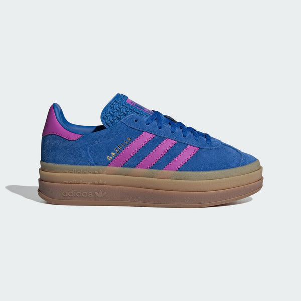 adidas Gazelle suede sneakers with stacked three-layer design, serrated 3-Stripes, and metallic-gold "Gazelle" logo.