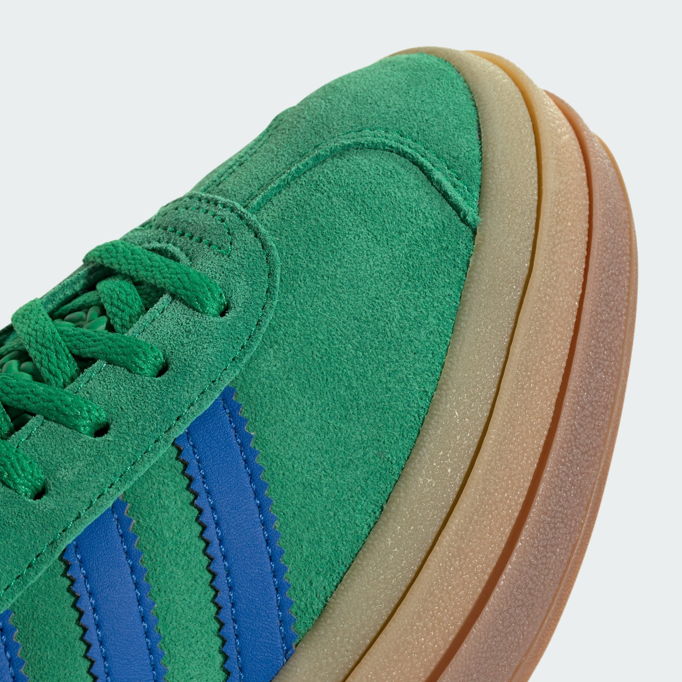 adidas Gazelle in soft suede with serrated 3-Stripes, stacked three layers high, and metallic-gold logo.