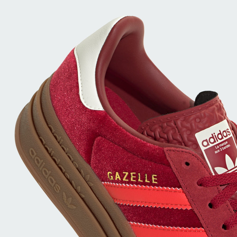 Adidas Gazelle Bold shoes with a layered platform outsole, luxurious velvet upper, and suede accents, inspired by classic '70s trainers.


