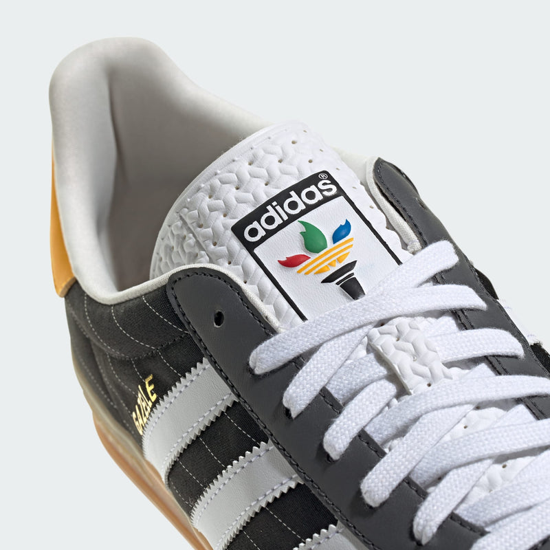 adidas Gazelle shoes with satin upper, suede and synthetic overlays, pinstripe details, and translucent gum outsole.