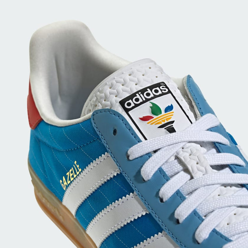 adidas Gazelle shoes with satin upper, suede and synthetic overlays, pinstripe details, and translucent gum outsole.