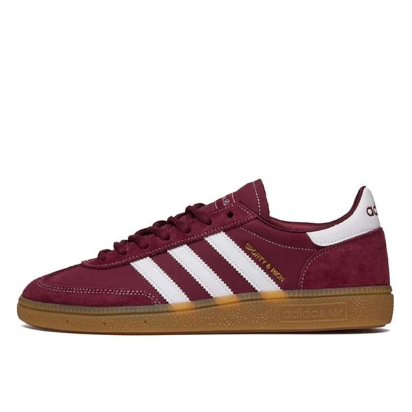 Handball Spezial x Sporty & Rich - Shadow Red sneaker with a suede upper, white 3-Stripes, gold-foil branding, and a gum rubber outsole.