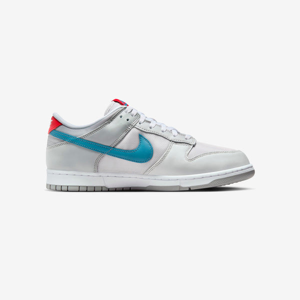 Nike Dunk silver superhero edition 20th anniversary with Flat Silver and Neutral Grey leather, airy textiles, Aegean Storm, and Gym Red accents.