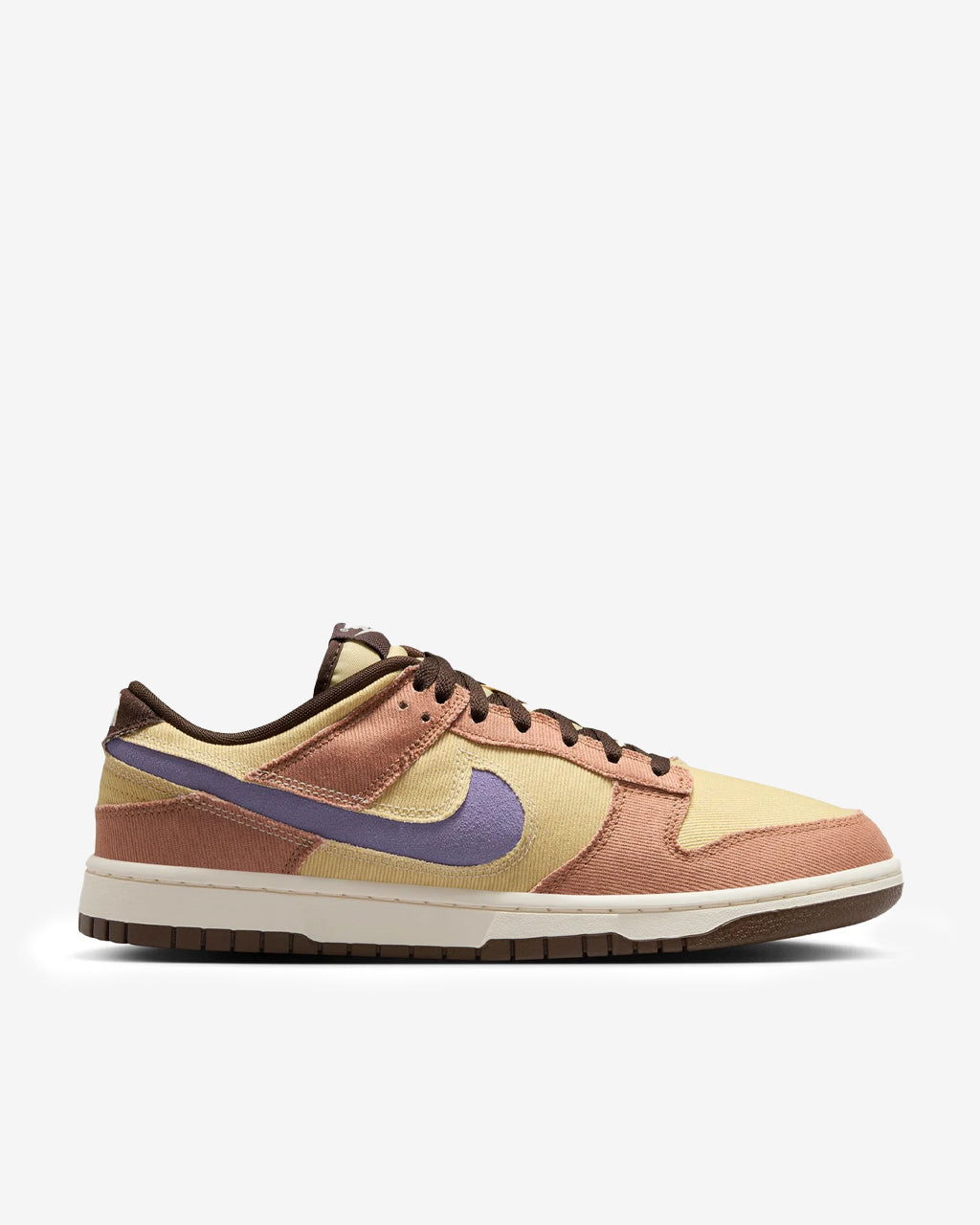 Dunk Low sneaker with iconic color blocking, corduroy layers, and plush padding for comfort and style.