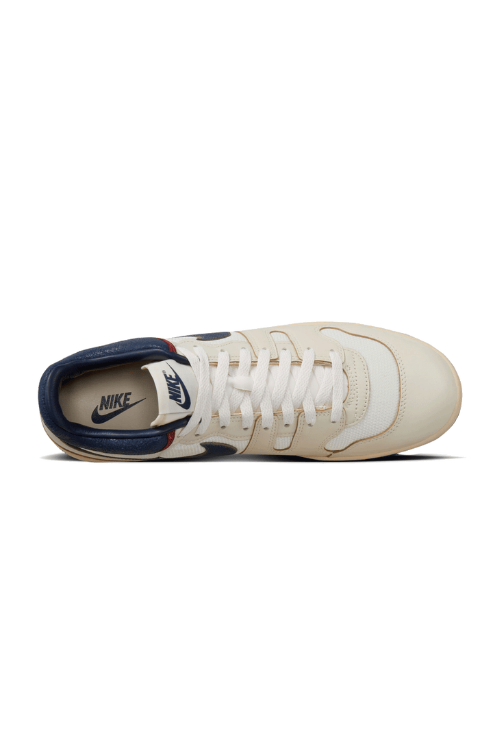 Retro-inspired Sneaker: Coconut Milk Leather with Midnight Navy Accents, Checkered Tongue Label, Painted Midsole