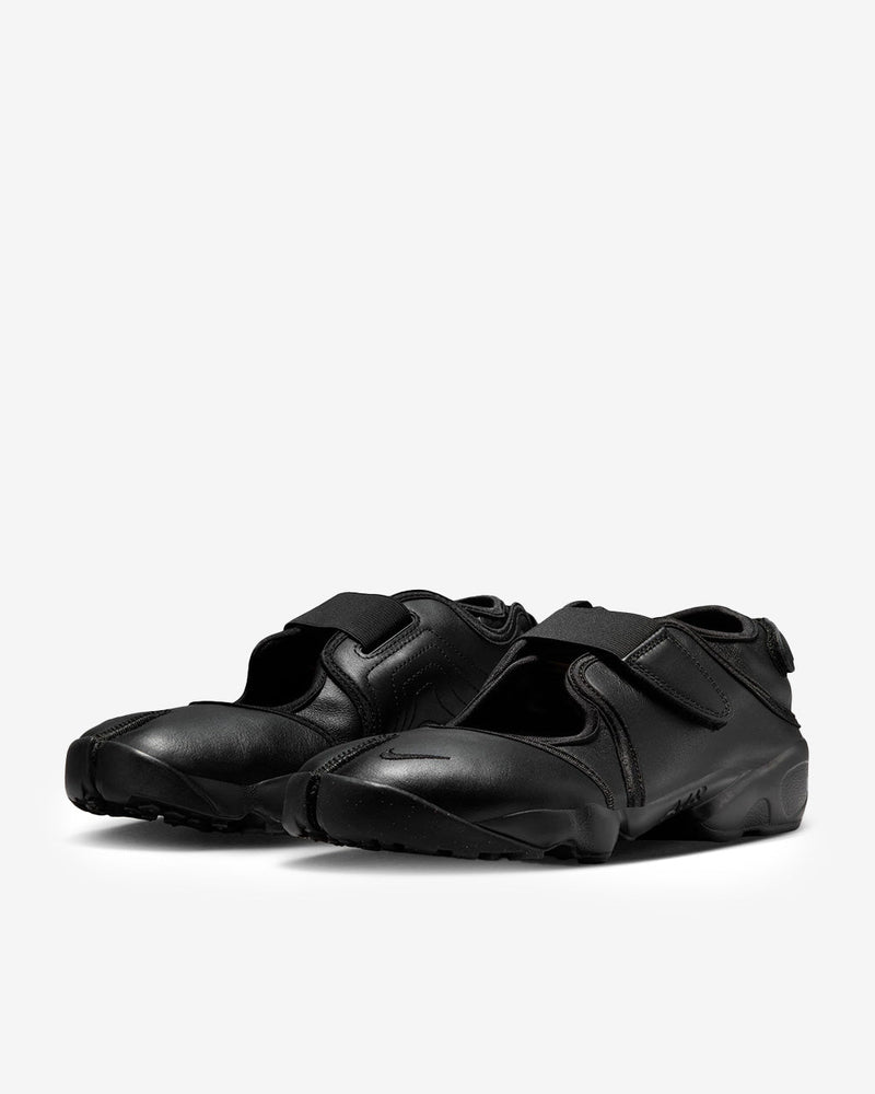 Air Rift Pure Platinum sneaker-sandal hybrid with full-grain leather upper, adjustable straps, split-toe design, and plush foam midsole with Air cushioning.