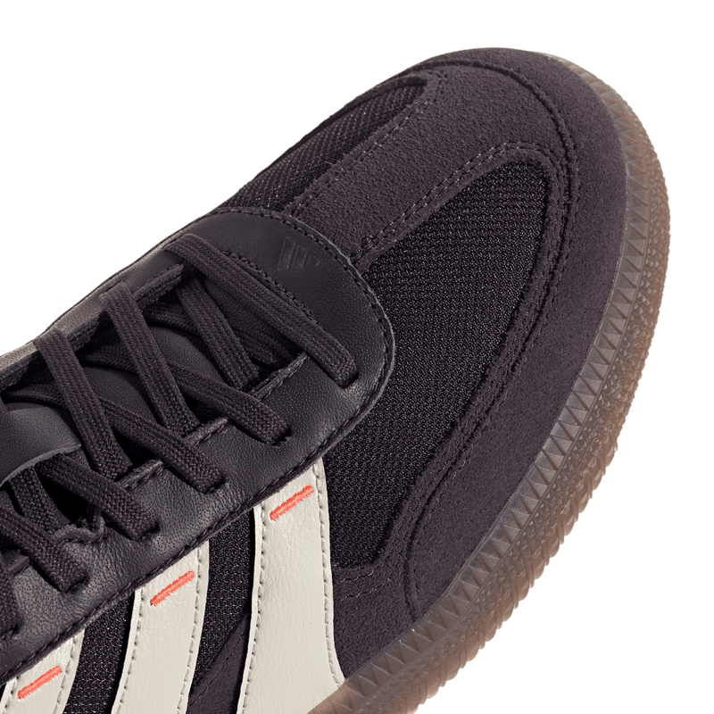 Adidas Predator Freestyle soccer shoes with suede and mesh upper, lightweight Lightstrike midsole, and Samba outsole, made with recycled and renewable materials.