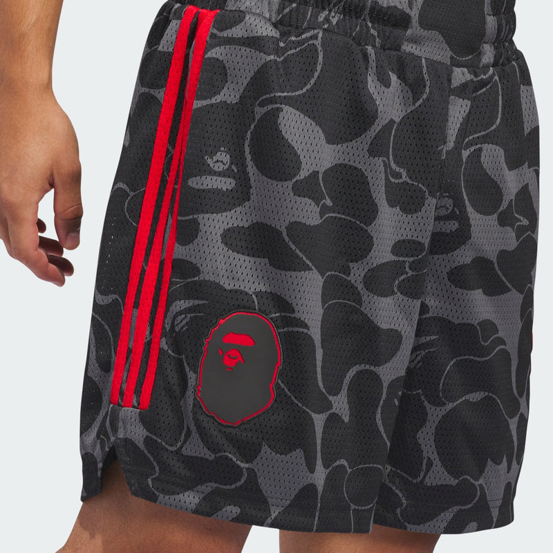 Damian Lillard x BAPE® basketball shorts in breathable polyester mesh, featuring drawcord-adjustable waistband and distinctive Dame and BAPE® graphics.