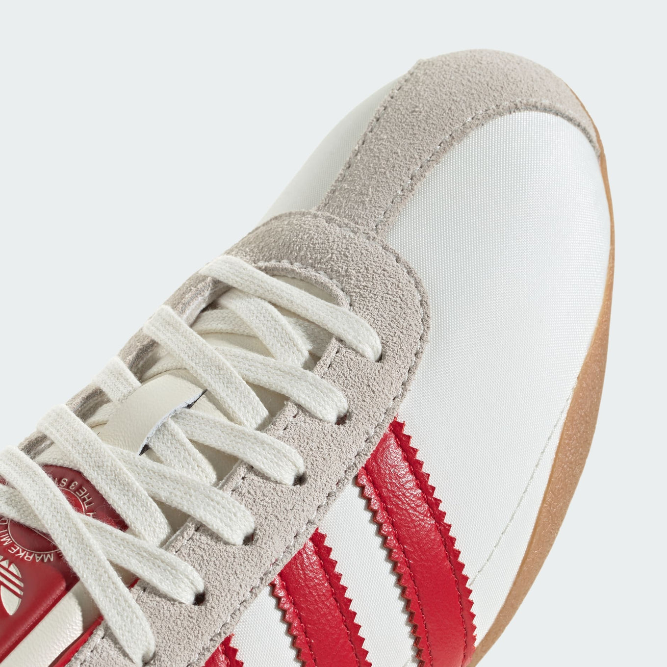 adidas Tokyo shoes with a sleek, vintage-inspired silhouette, nylon upper, and grippy rubber outsole for everyday comfort and style.