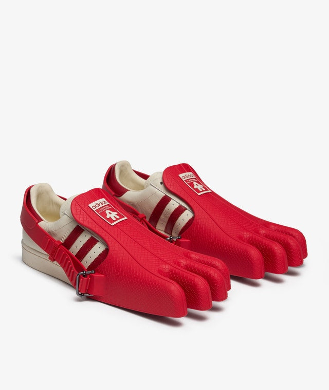 AVAVAV x adidas Originals Superstar sneaker featuring oversized, finger-like extensions on the shell toe with signature three stripes and co-branded details.