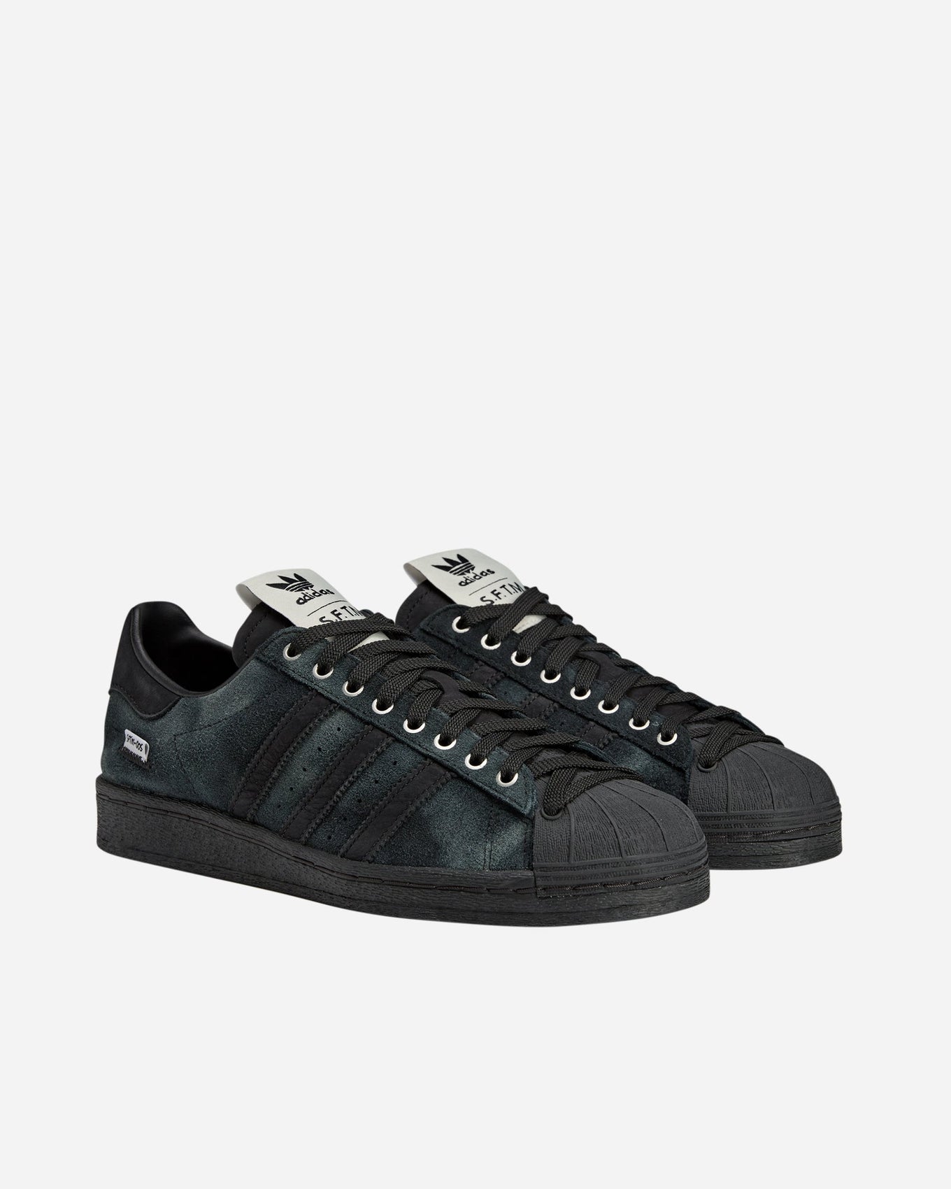 adidas Superstar 82 sneakers with a hand-buffed leather upper, tonal leather shell toe, and waxed laces, inspired by work boots.