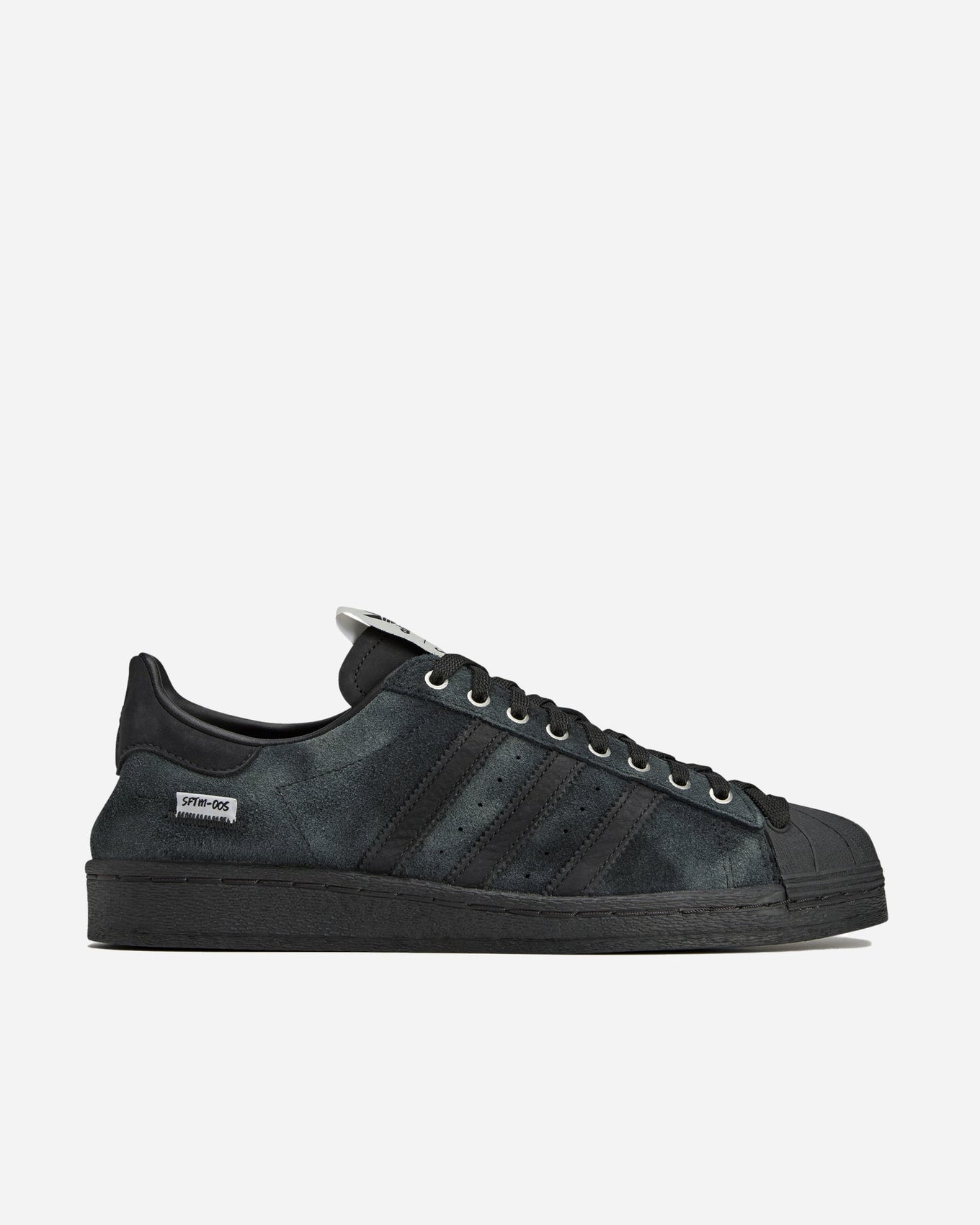 adidas Superstar 82 sneakers with a hand-buffed leather upper, tonal leather shell toe, and waxed laces, inspired by work boots.